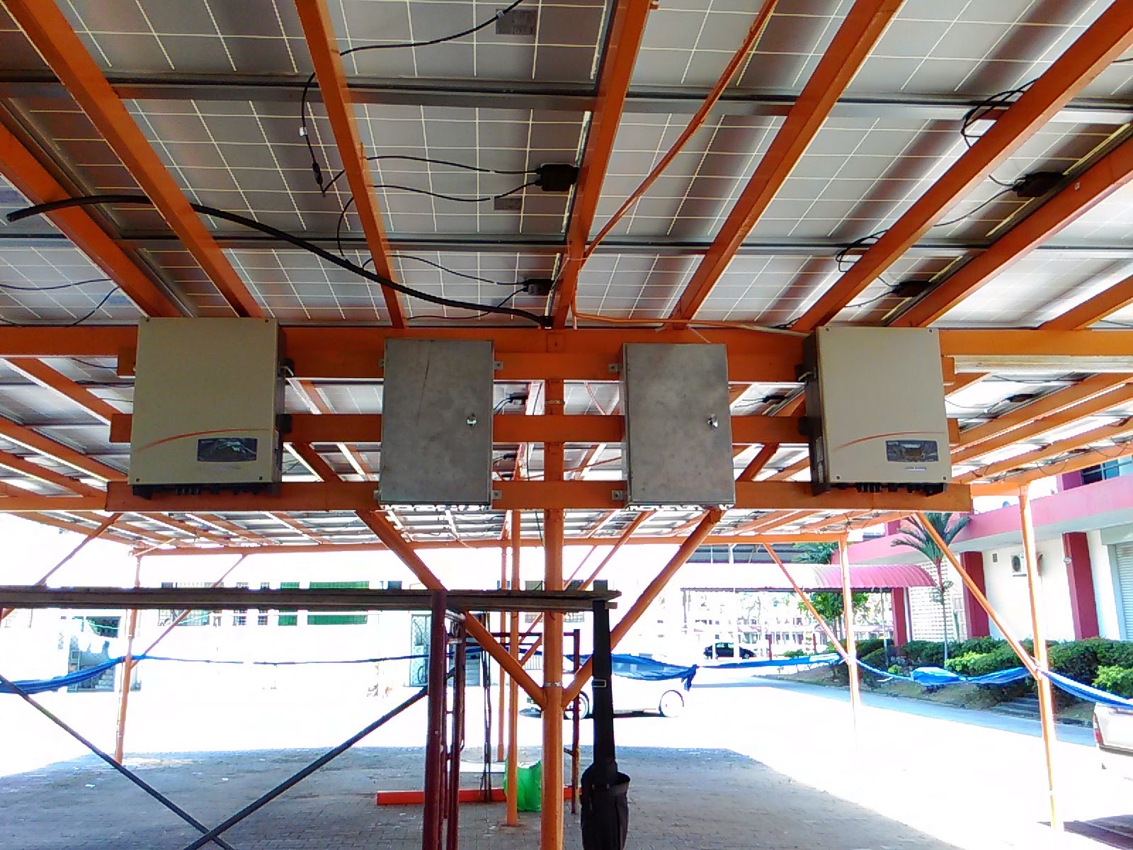 Inverters mounted below solar canopy structure